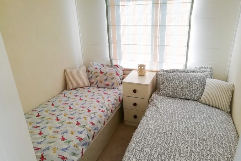 Twin bedroom with airplane bedding at Mo's Keep respite lodge, Shorefield