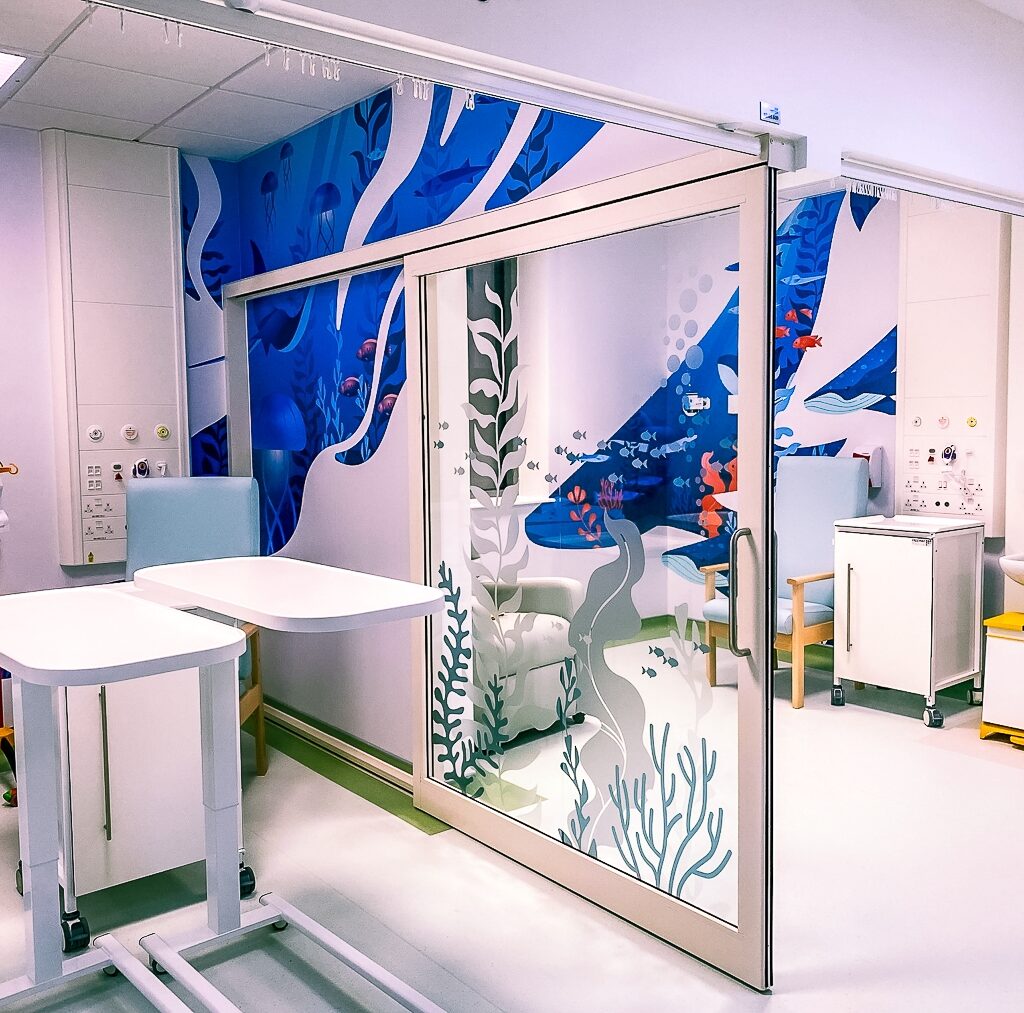 Paediatric oncology unit at Kingston Hospital with colourful fish decals decorating the window screens, part of Momentum's hospital ward improvements.