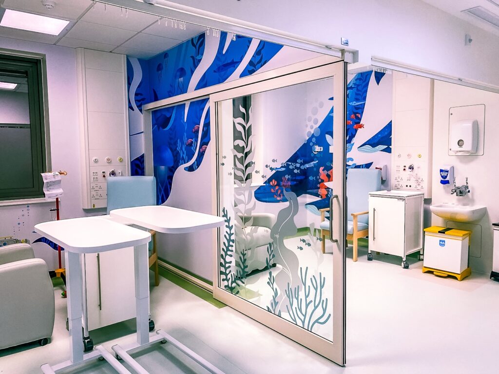 Paediatric oncology unit at Kingston Hospital with colourful fish decals decorating the window screens, part of Momentum's hospital ward improvements.