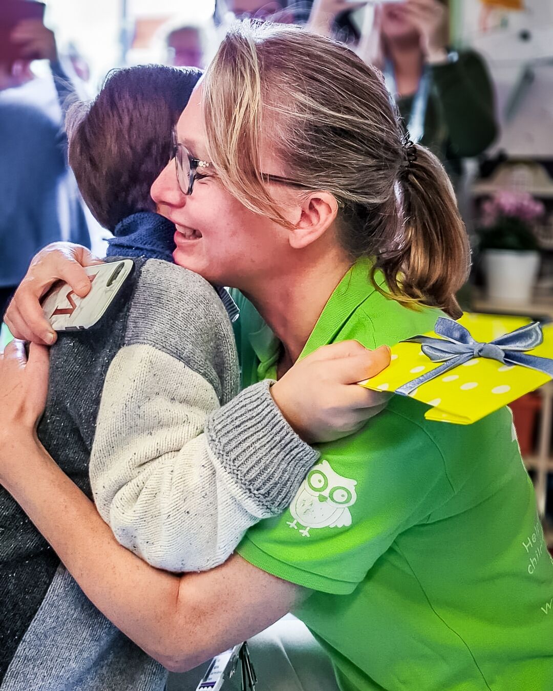 A social worker hugging a child supported by Momentum Children's Charity.