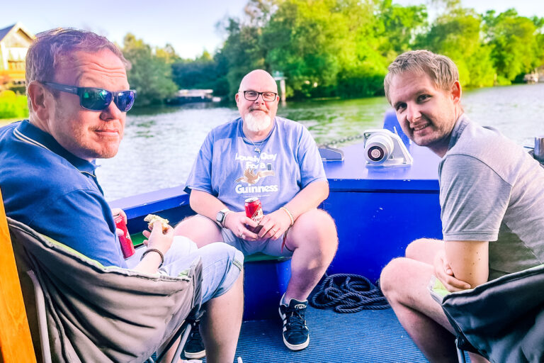 Fathers supported through Momentum's Echoes programme having a drink at the front of the Momentum boat.