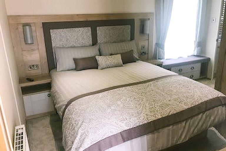 Master bedroom with double bed inside Momentum Children's Charity respite holiday home.