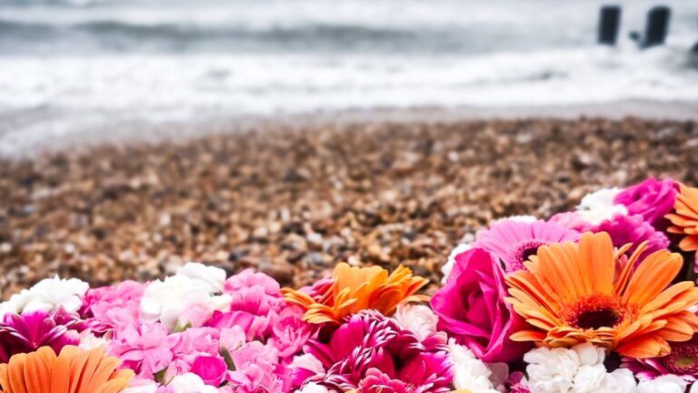 Flower wreaths laid on the beach in memory of a child supported by Momentum's Echoes programme who died.