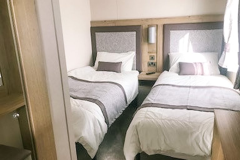 Twin bedroom for children inside Momentum Children's Charity respite cabin at Church Farm.