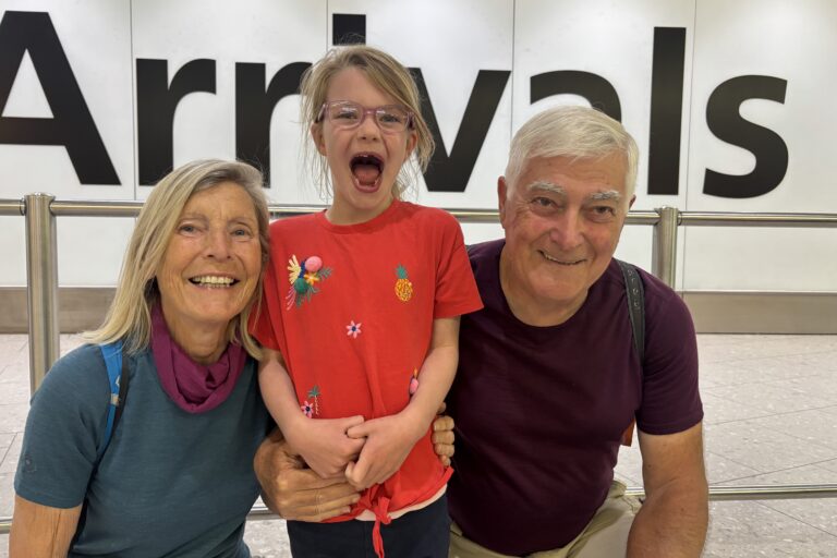 Grandparents are reunited with their granddaughter at Heathrow Airport