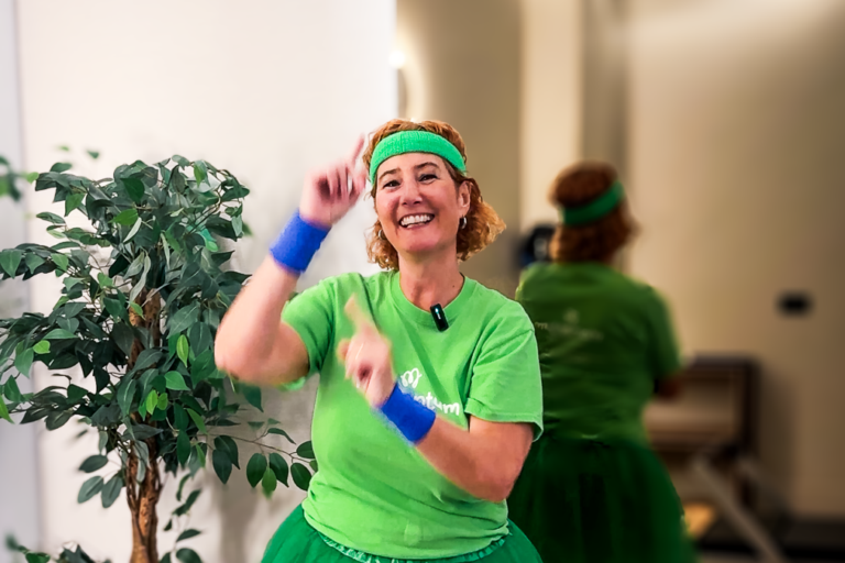 Momentum CEO in preparation for 24 hour Danceathon wearing green tutu