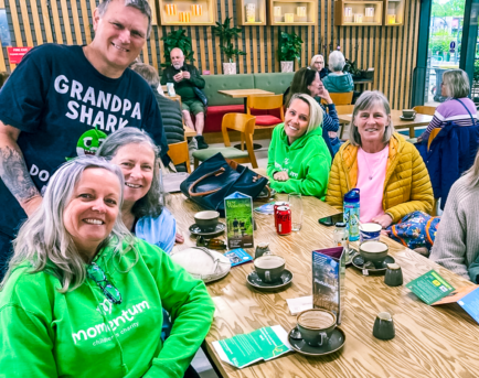 A group of grandparents supported by Momentum meet up over coffee with Family Support Workers