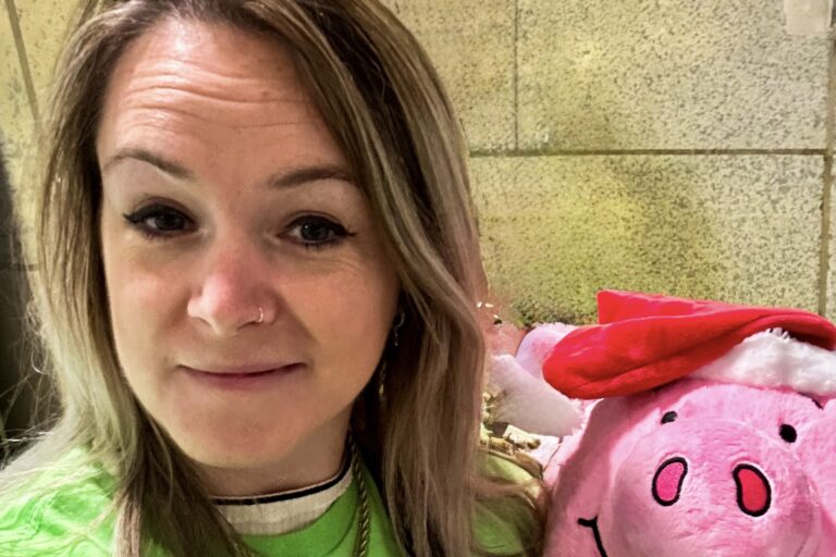 Momentum's Head of Fundraising and Engagement poses with Percy Pig ahead of her 'Move for Momentum' challenge.