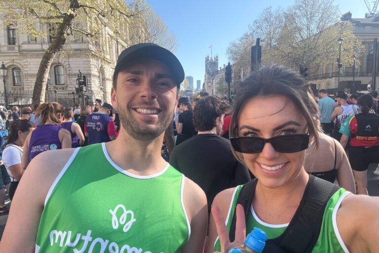 Two runners take a selfie at the start of the London Marathon