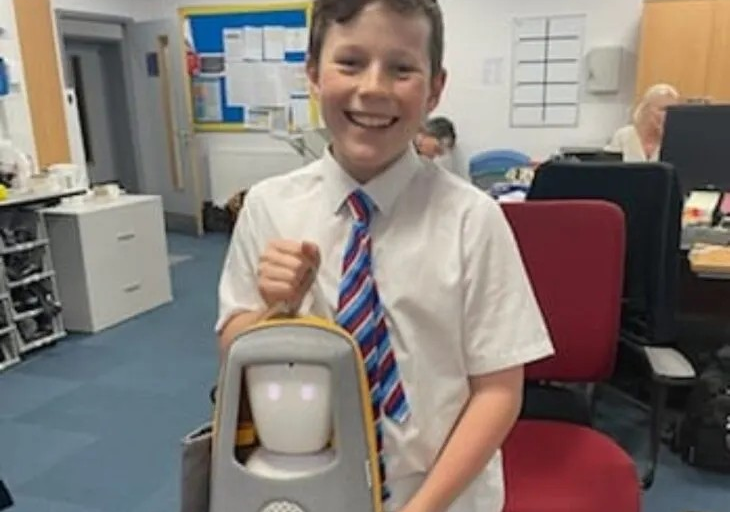Supported child at school with his robot.