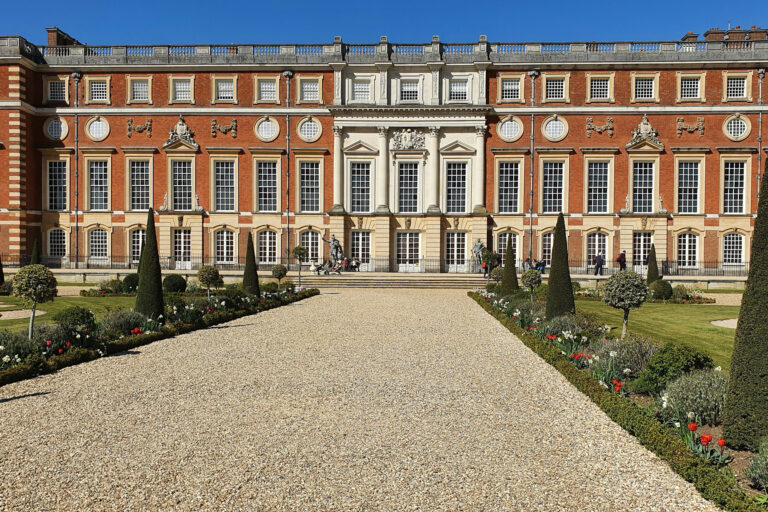 The grand red-brick façade of Hampton Court Palace, showcasing the historic surroundings of the Hampton Court Challenge charity marathon event.