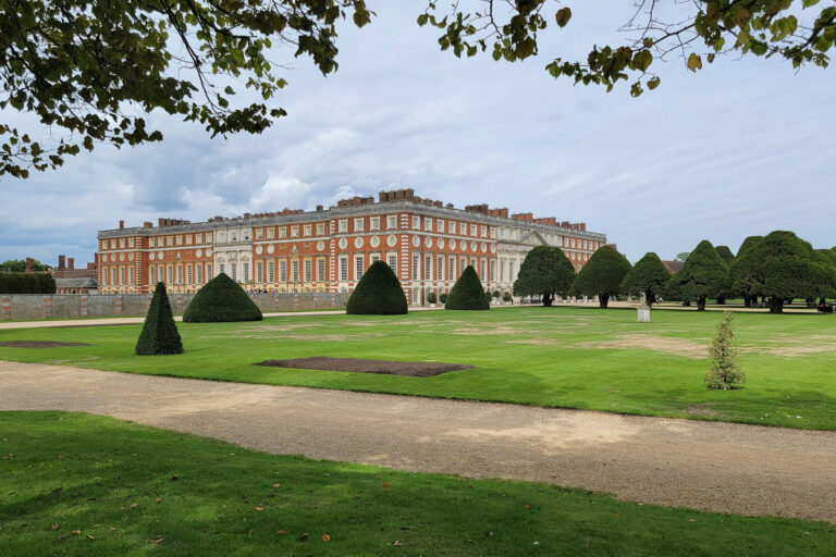 The grand red-brick façade of Hampton Court Palace, showcasing the historic surroundings of the Hampton Court Challenge charity marathon event.