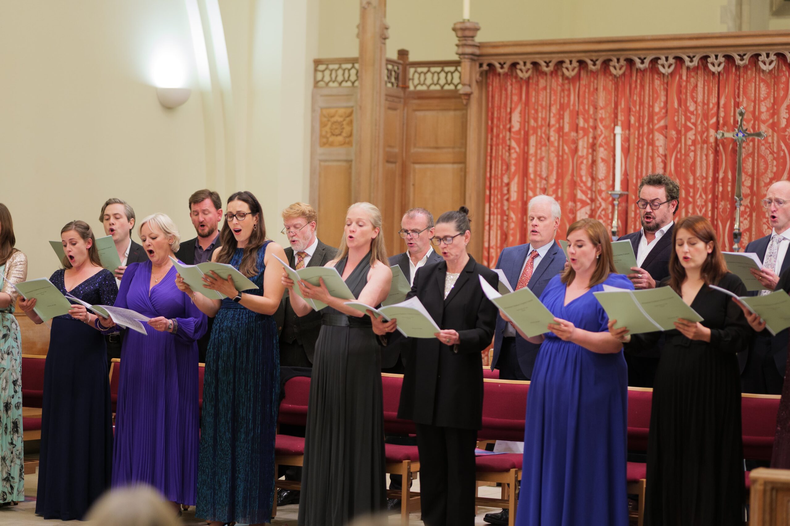 A group of chorus members sing at Momentum's opera event