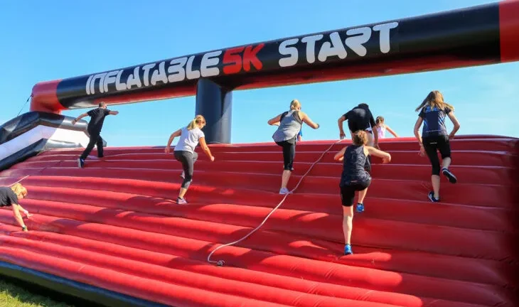 Supporters take part in a 5k inflatable race, raising money for Momentum Children's Charity.